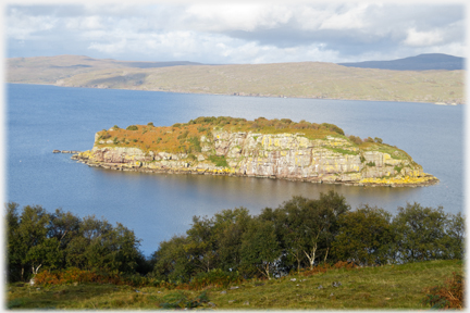 Rocky cliffs of small island.