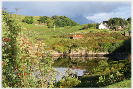 Ardheslaig with rowan berries, red tin roof and red phone-box.