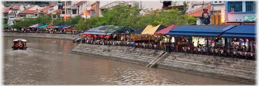 The cafes that line Boat Quay.