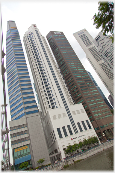 Three towers - Maybank, New Bank of China and 6 Battery Road, crowd together by Cavenagh Bridge.