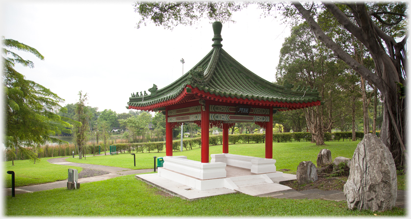 Pavilion with rocks by lawns.