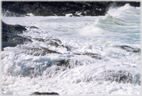 Sea foaming on the rocks of Barra's coast.
