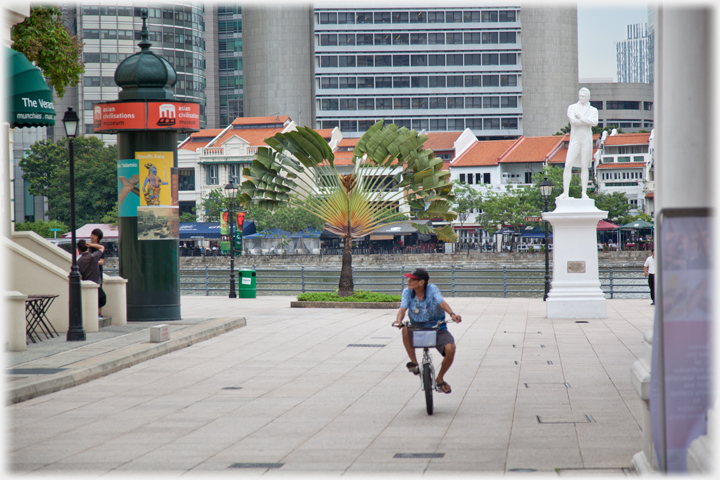 Piazza by Raffles Statue with cyclist.