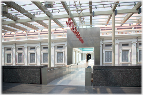 Covered area between old and new buildings of Singapore National Museum.