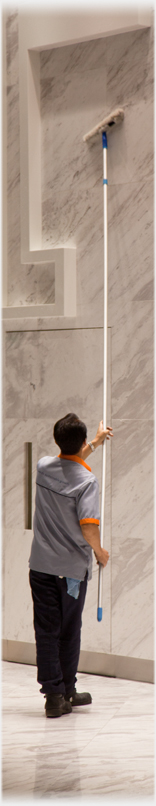 Man cleaning marble wall.