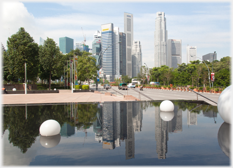 Pool with balls reflecting the Downtown Core.