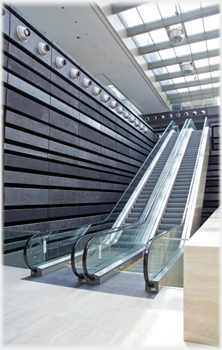 Escalator with textured walls in the National Gallery.