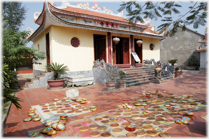 Courtyard ground covered with coils of incense drying.