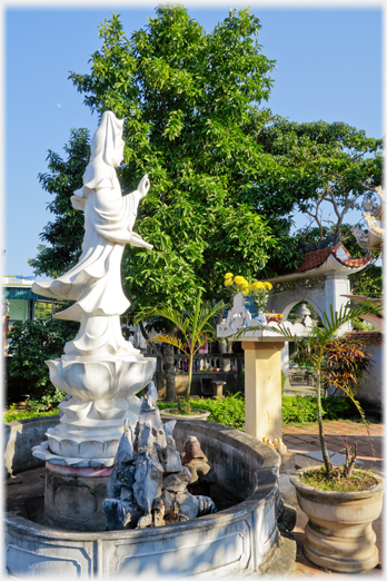 Standing female buddha.