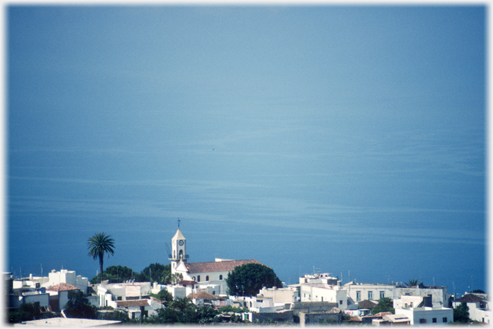 Village with sea beyond.