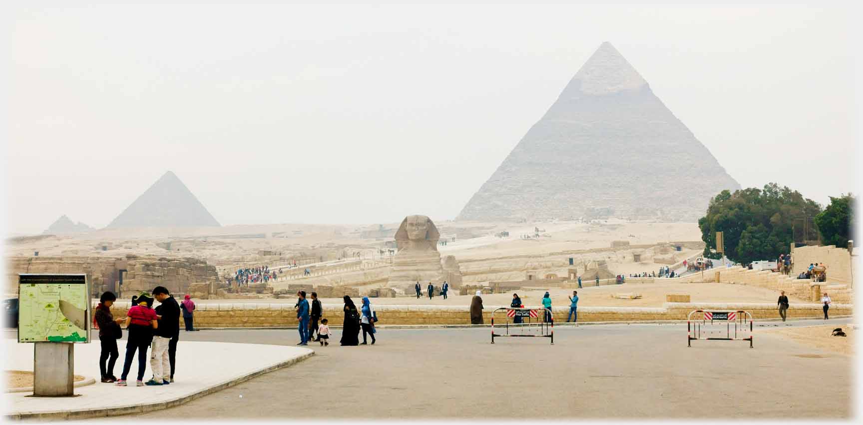 Pyramids with sphinx in foreground.
