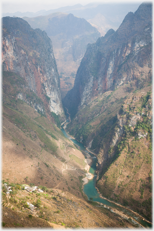 Looking down into a very deep gorge with river at bottom.