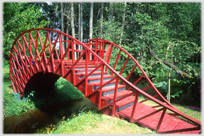 A red bridge curving in three dimensions.