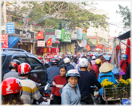 Looking over packed street of motorcylists.