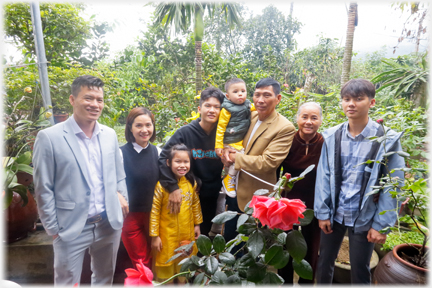 Duyen's and family with her parents in their garden.