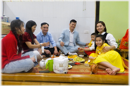 Two families on raised dais .