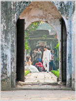 Looking through doorway at wedding couple.