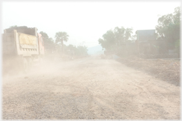 Truck raising dust.