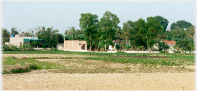 Concrete houses at one edge of the village.