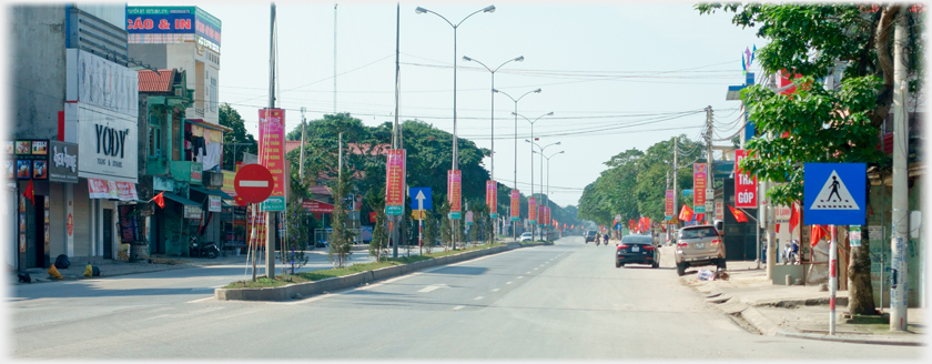 Quiet stretch of the new road with grassed central reservation.