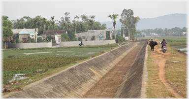 Long straight empty water channel.