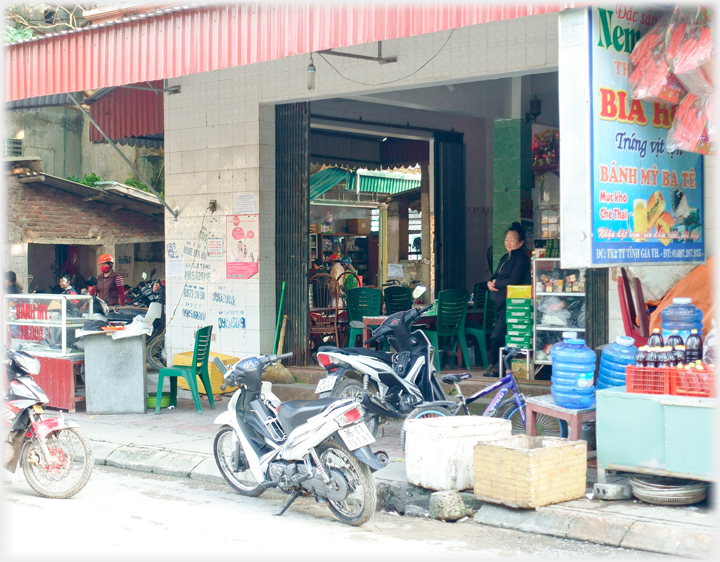 View of the bar from the main shopping street, Ba Hai standing in the looking out.