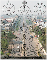Looking through a wirework window onto Vientiane's main thoroughfare.
