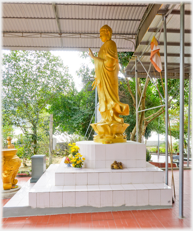 A golden standing Buddha.