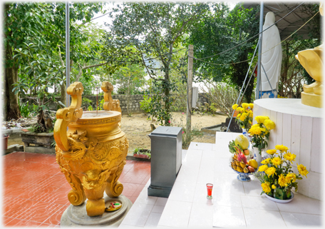 Goldern urn for incense sticks.