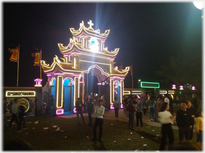An entrance gate outlined in lights.