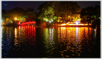 The Huc Bridge and the entrance gate to the Ngoc Son Pagoda .