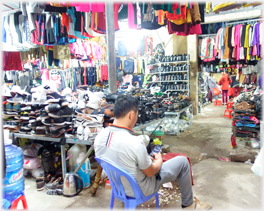 Man sitting with shoes.