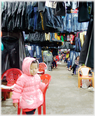 Aisle with suits.