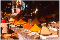 Conic piles of spices in a shop.