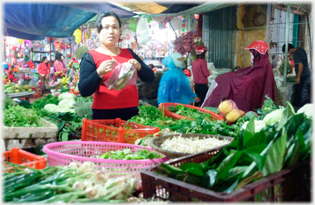 Woman and fruit stall.