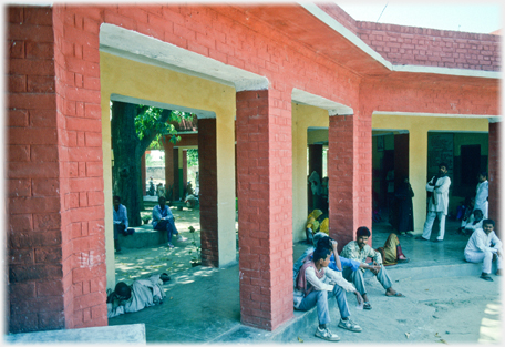 Patients waiting on steps.