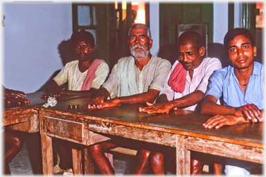 Men exercising their hands.