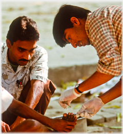 Physio inspecting the man's foot.