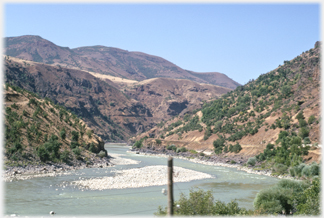 Railway running beside river.