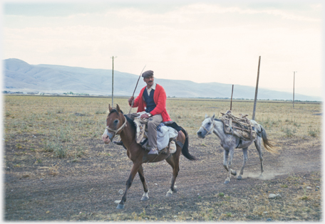 Horseman and pony on road in Anatolia.