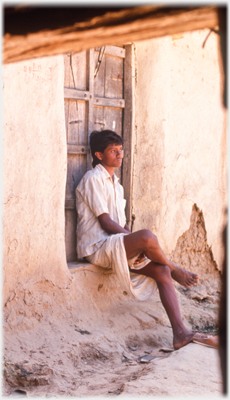 Young man in doorway.