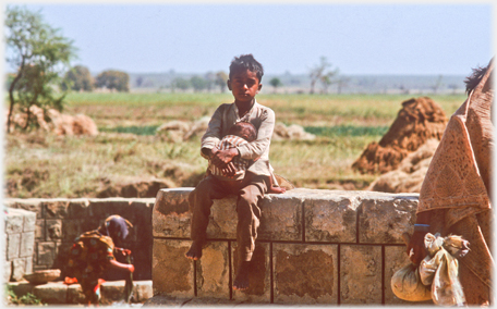 Boy with infant.