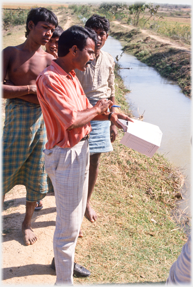 Paramedic interviewing villager.