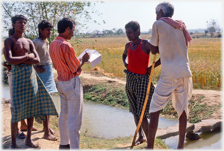 Paramedics interviewing villagers.