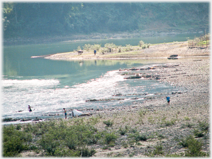 River curving round beach four figures dotted.