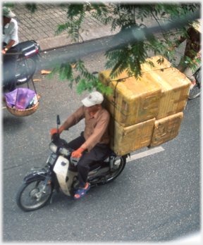 Four large boxes behind driver.