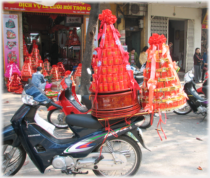 Two conical gift wrapped wedding accessories.