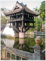 The One Pillar Pagoda standing on its one leg in a pond.