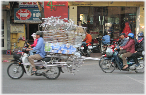 Pile of metal work above the head of driver.