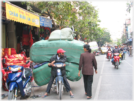 From front driver with two huge sacks beind and above him.